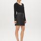 Black Faux Leather Mini Skirt with Back Zipper - Woman Wearing Sleek Polyurethane Skirt - Suzy Shier