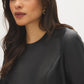 Jet Black Mini Faux Leather Dress with Belted Waist - Close-up Fabric Detail - Suzy Shier