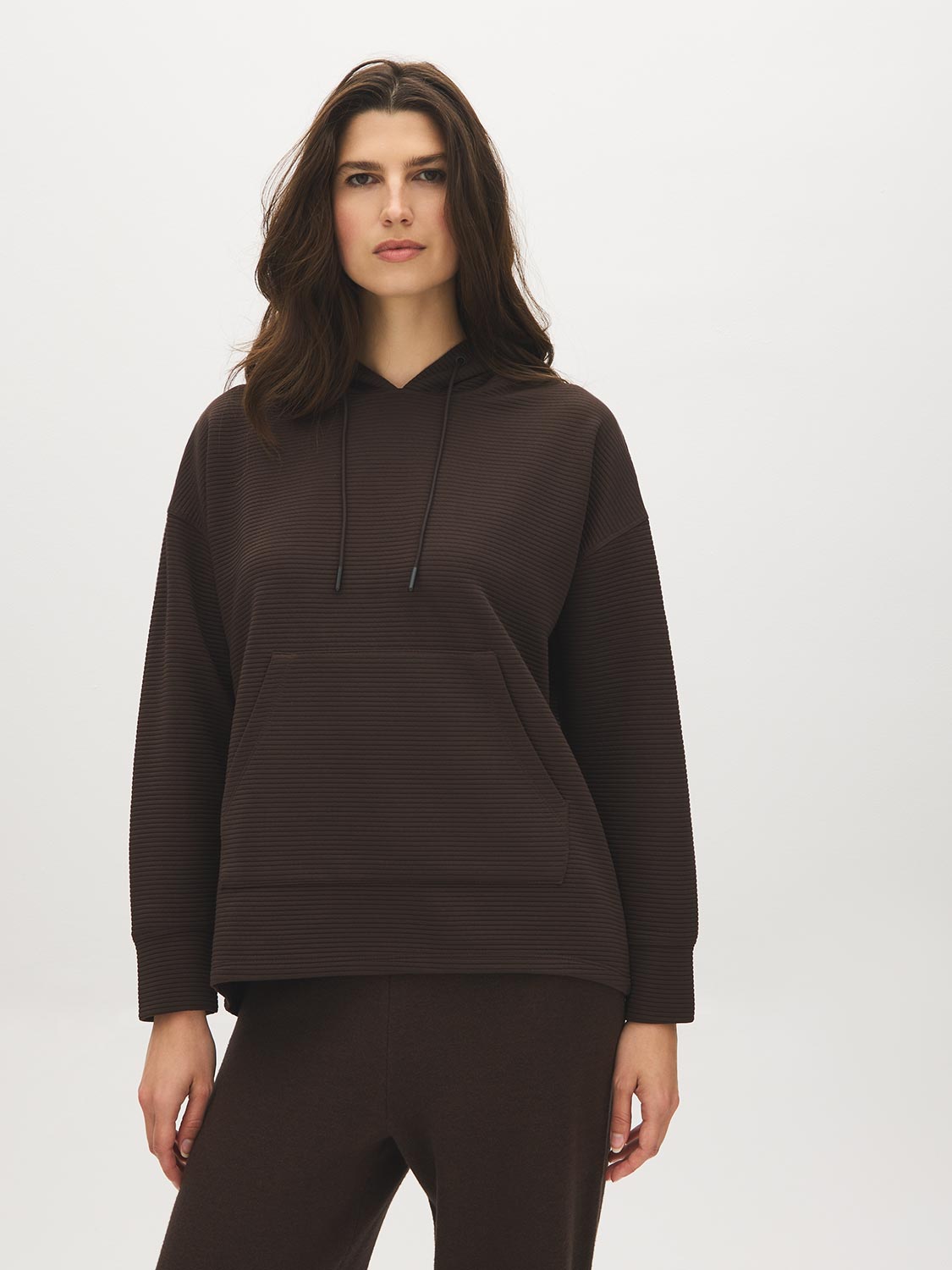 Dk Brown Ottoman Rib Hoodie with Kangaroo Pocket - Woman Wearing Cozy Knit Top - Suzy Shier