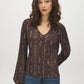 Black Snake Print Balloon Sleeve Top - Woman Wearing V-Neck Crinkle Knit Blouse - Suzy Shier