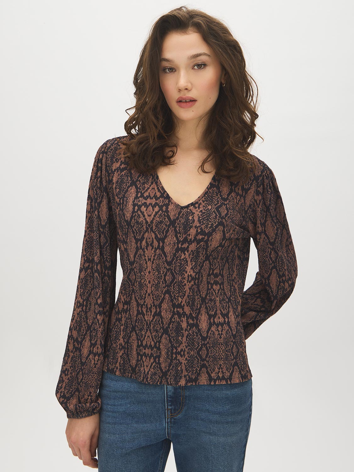 Black Snake Print Balloon Sleeve Top - Woman Wearing V-Neck Crinkle Knit Blouse - Suzy Shier
