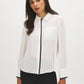 Bright White faux-leather Trim Long Sleeve Blouse - Woman Wearing Woven Shirt with Hidden Button Placket - Suzy Shier