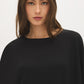 Jet Black Asymmetrical Knit Poncho Top - Close-up Fabric Detail - Suzy Shier