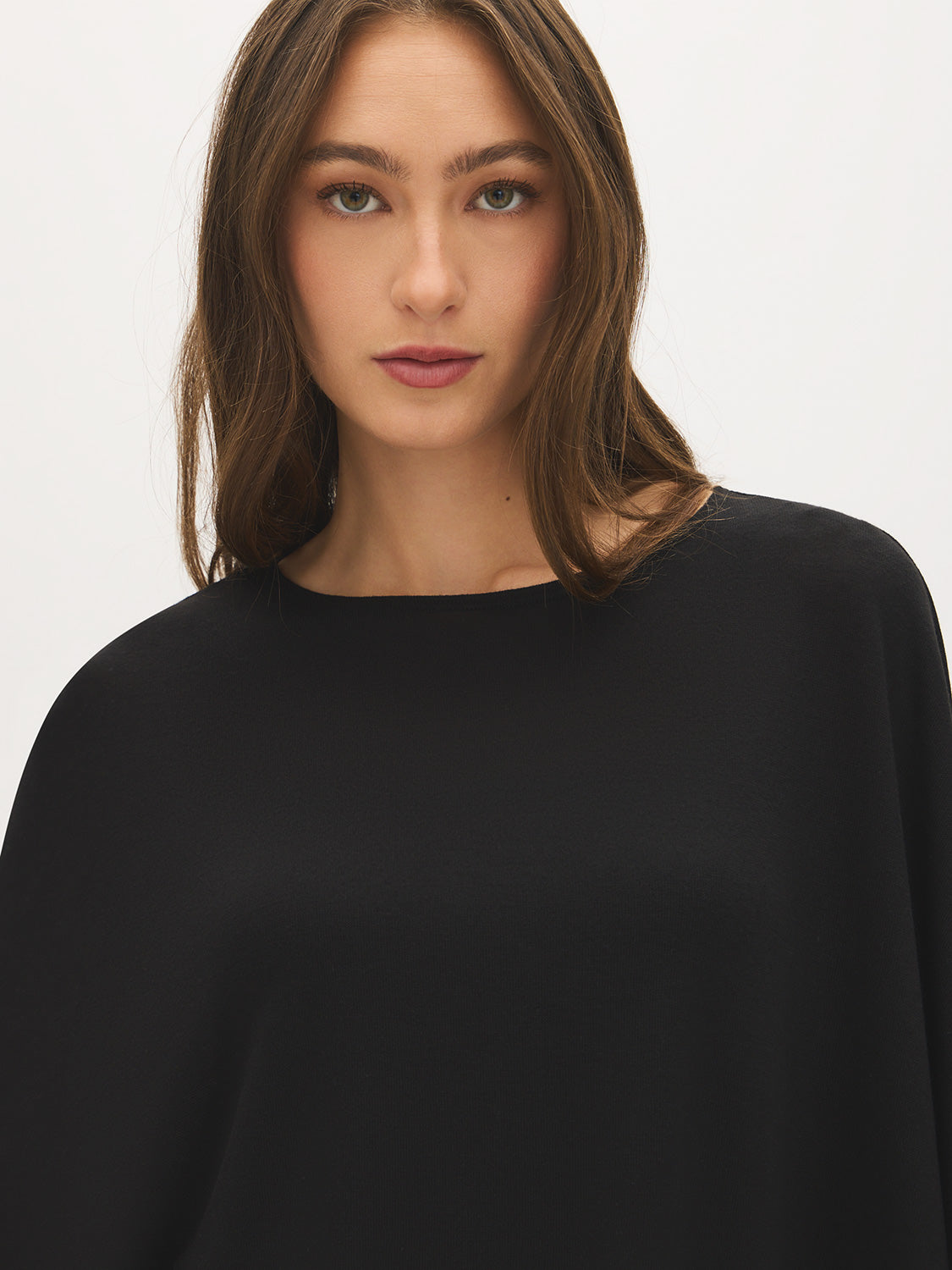 Jet Black Asymmetrical Knit Poncho Top - Close-up Fabric Detail - Suzy Shier