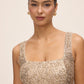 Gold Sequin Fit & Flare Midi Dress with Pleating - Close-up Neckline Detail - Le Chateau
