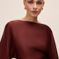 Brick Satin Boat Neck Sheath Dress - Close-up Fabric Detail - Le Chateau