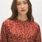 Arabian Spice Satin-Like Animal Print Peplum Blouse - Close-up Fabric Detail - Suzy Shier