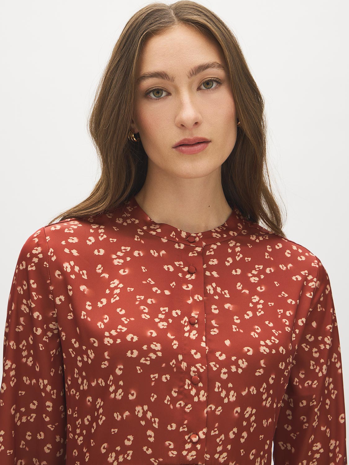 Arabian Spice Satin-Like Animal Print Peplum Blouse - Close-up Fabric Detail - Suzy Shier