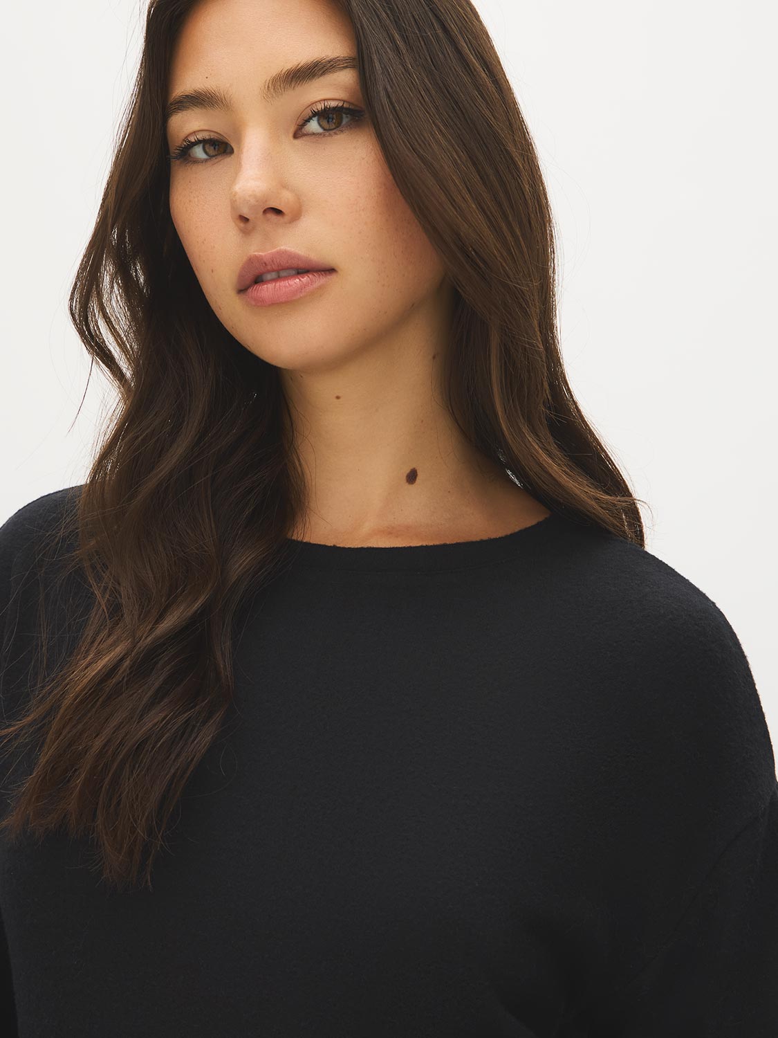 Black Crew Neck Hacci Top with Lace Trim - Close-up Fabric Detail - Suzy Shier