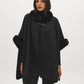 Black Knit Cape with Faux Fur Trim - Woman Wearing Elegant Cape with Fur Details - Suzy Shier