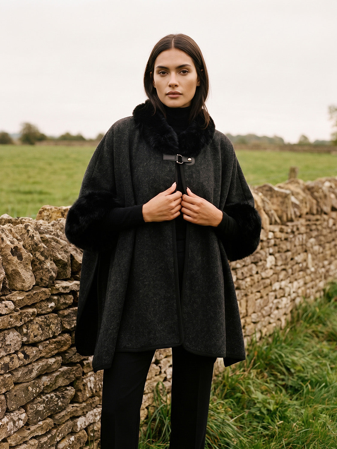 Black Knit Cape with Faux Fur Trim - Woman Wearing Elegant Cape with Fur Details - Suzy Shier