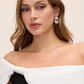 Black/White Asymmetrical Off-Shoulder Knit Jumpsuit - Close-up Shoulder Detail - Le Chateau