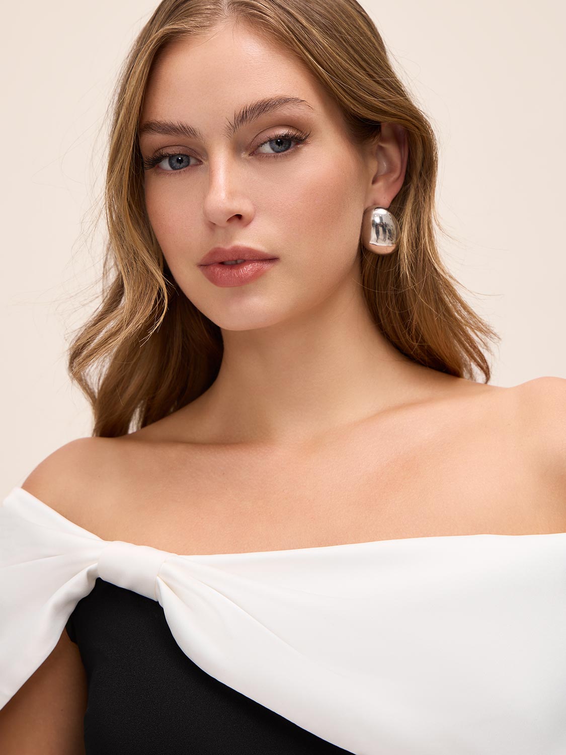 Black/White Asymmetrical Off-Shoulder Knit Jumpsuit - Close-up Shoulder Detail - Le Chateau