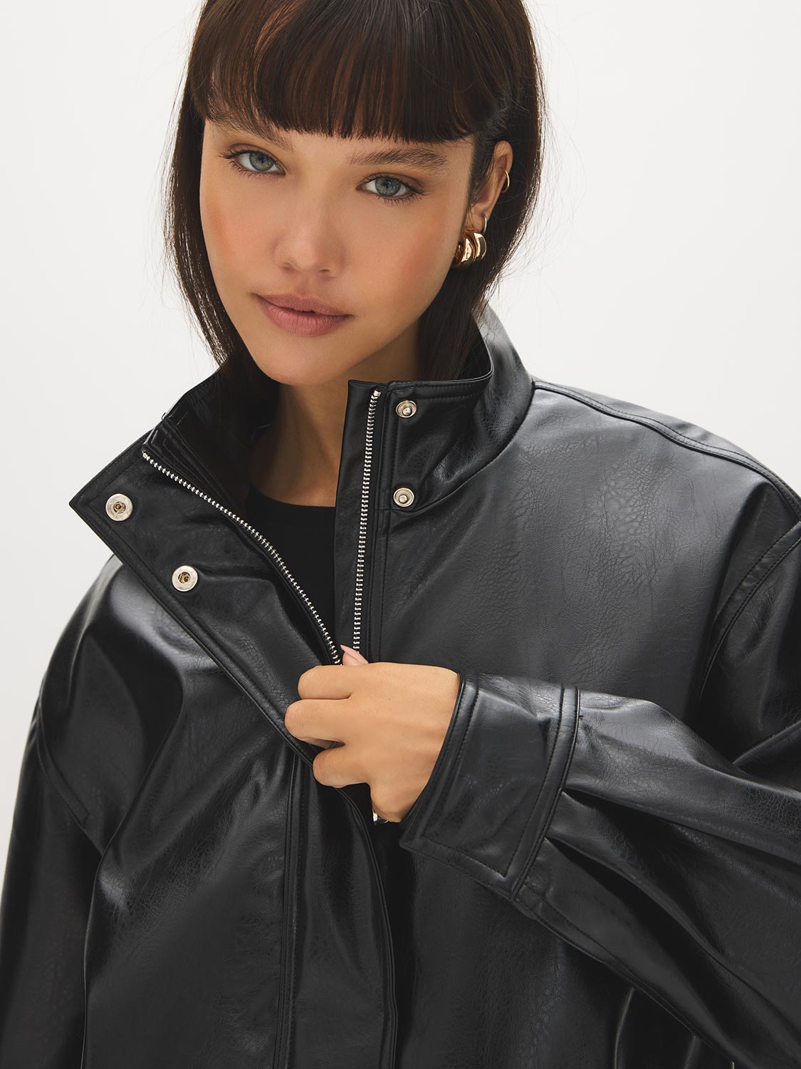 Black Vegan Leather Bomber Jacket with Funnel Neck - Close-up Detail - Suzy Shier