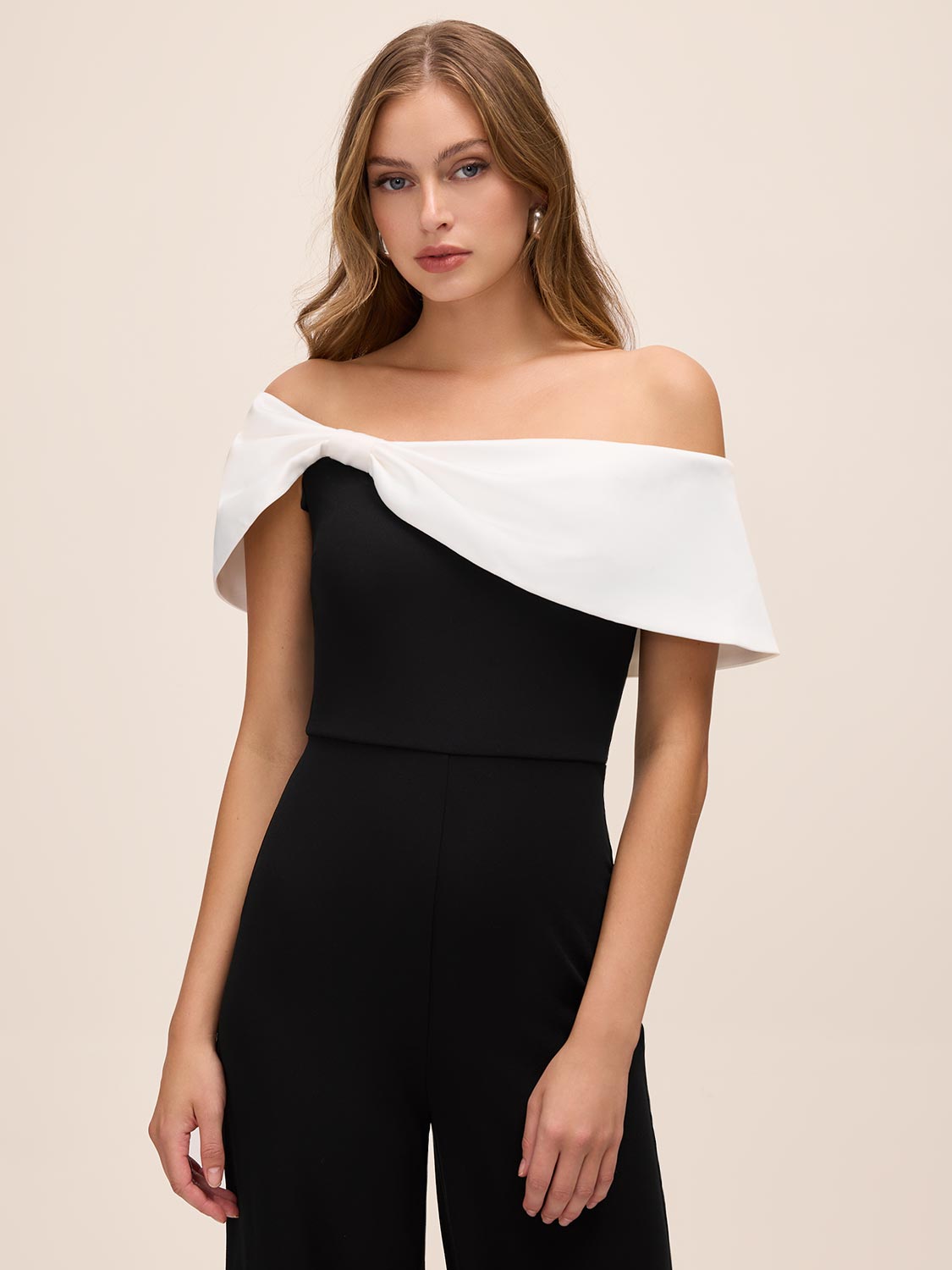 Black/White Asymmetrical Off-Shoulder Knit Jumpsuit - Side Profile View - Le Chateau