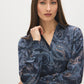 Navy Printed Satin V-Neck Blouse - Close-up Fabric Detail - Suzy Shier