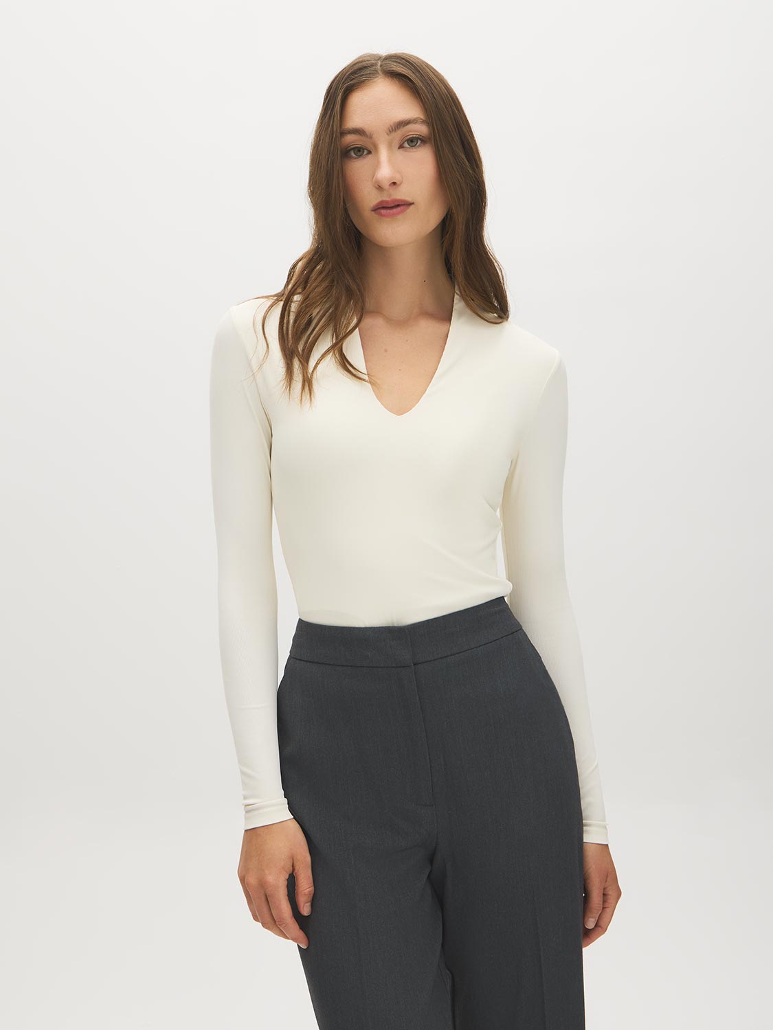 Egret Ribbed Deep V-Neck Stretch Jersey Top - Woman Wearing Fitted Long Sleeve Top - Suzy Shier