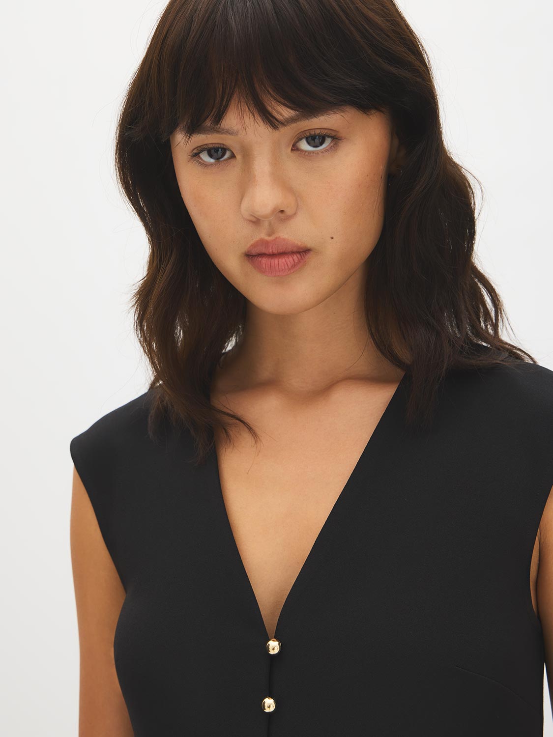 Black V-Neck Button-Front Knit Vest - Close-up Button Detail - Suzy Shier