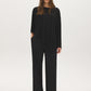 Jet Black Asymmetrical Knit Poncho Top - Front View - Suzy Shier