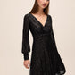 Black Sequin V-Neck Fit and Flare Mini Dress - Front View - Le Chateau
