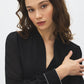 Jet Black V-Neck Top with Chiffon Sleeves and Rhinestone Cuffs - Close-up Cuff Detail - Suzy Shier