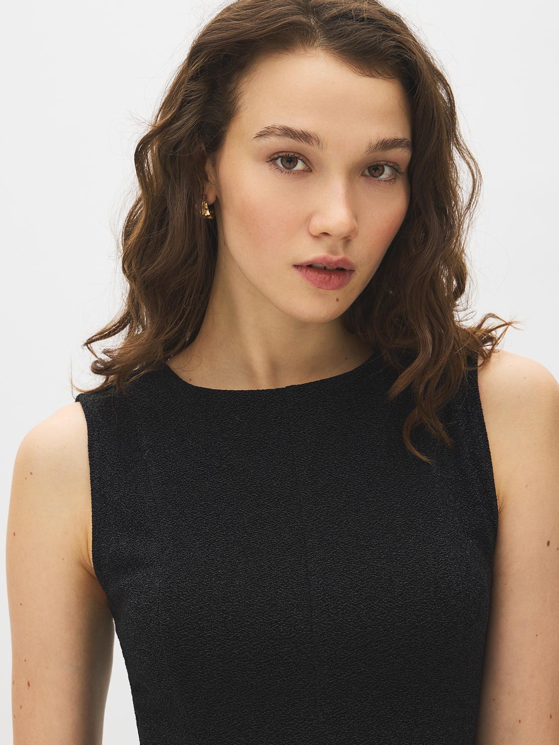 Black Sleeveless Glitter Knit Fit and Flare Top - Close-up Fabric Detail - Suzy Shier
