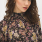 Black Paisley Mock Neck Top with Ruffle Hem - Close-up Fabric Detail - Suzy Shier