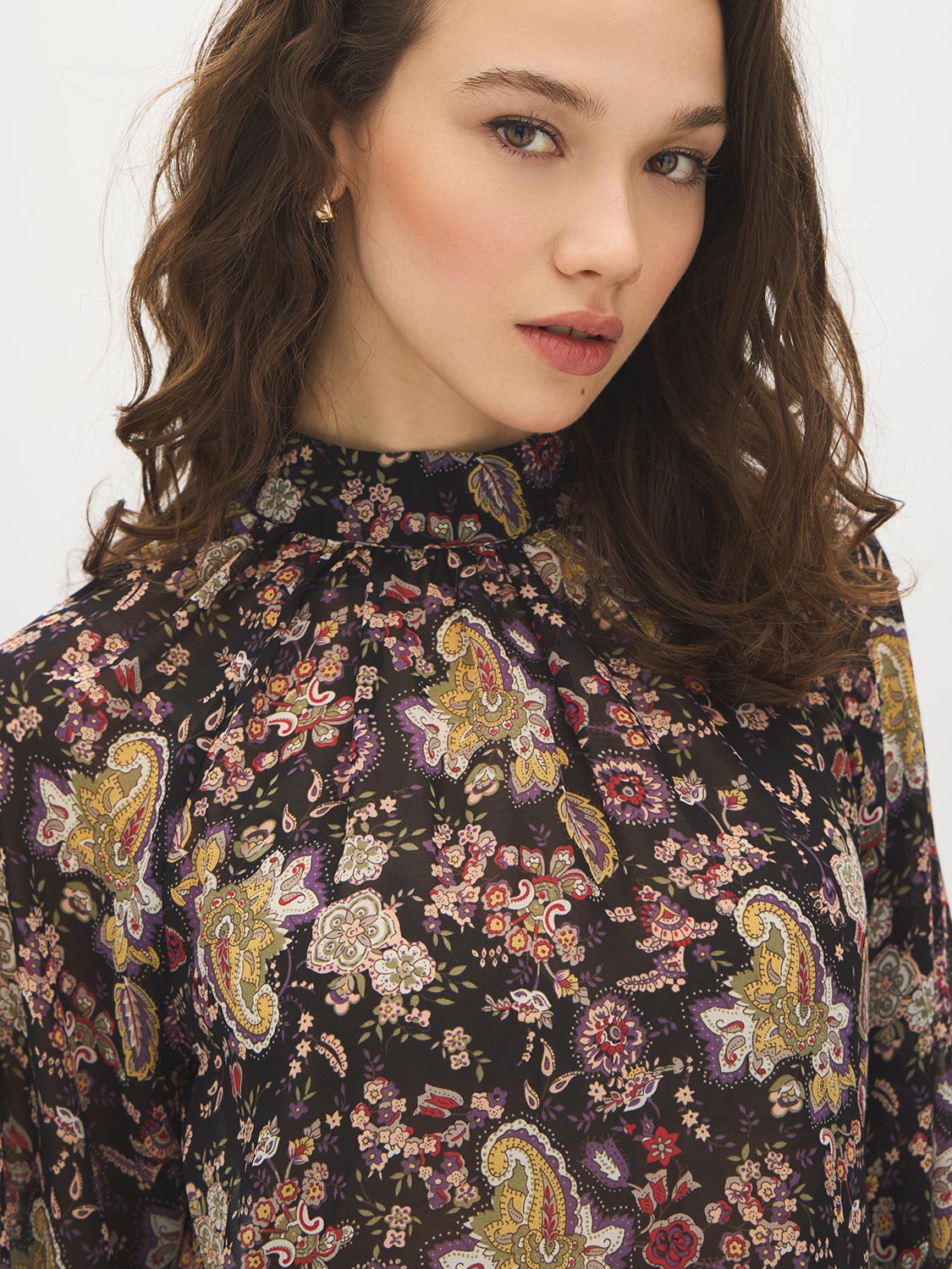 Black Paisley Mock Neck Top with Ruffle Hem - Close-up Fabric Detail - Suzy Shier