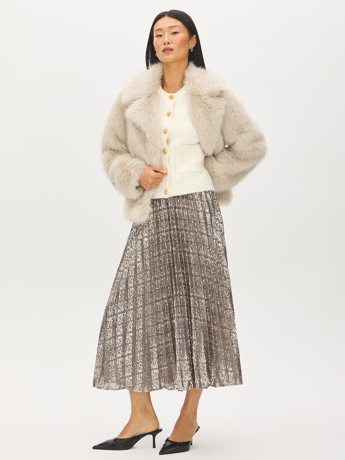 Snow White Short Sleeve Ribbed Button-Front Cardigan - Styled with Fur Coat Side View - Suzy Shier
