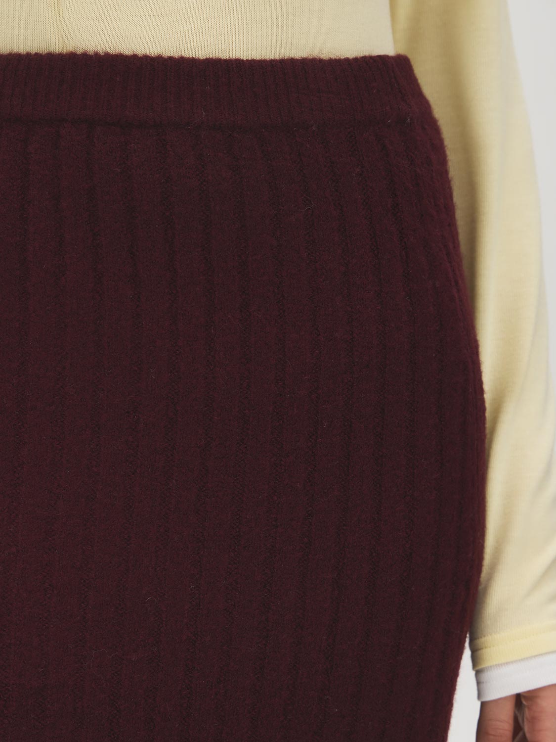 Bruised Burgundy Melange Ribbed Knit Sweater Skirt with Side Slit - Close-up Fabric Detail - Suzy Shier