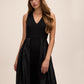 Black V-Neck Jumpsuit with Jacquard Skirt Overlay - Side Profile View - Le Chateau