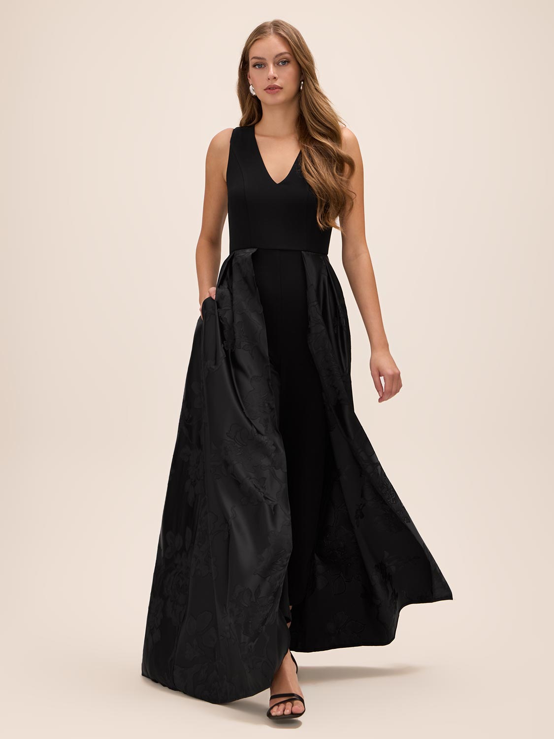 Black V-Neck Jumpsuit with Jacquard Skirt Overlay - Front View - Le Chateau