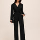 Black Crossover Neck Knit Jumpsuit - Woman Wearing Wide-Leg Evening Jumpsuit - Le Chateau