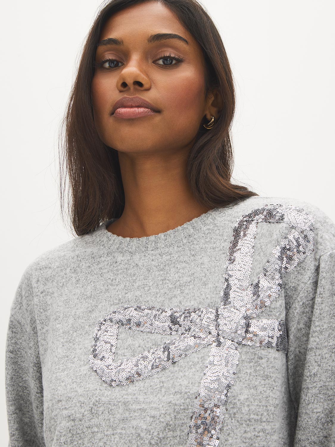 Grey Melange Crew Neck Hacci Top with Sequin Bow - Close-up Bow Detail - Suzy Shier