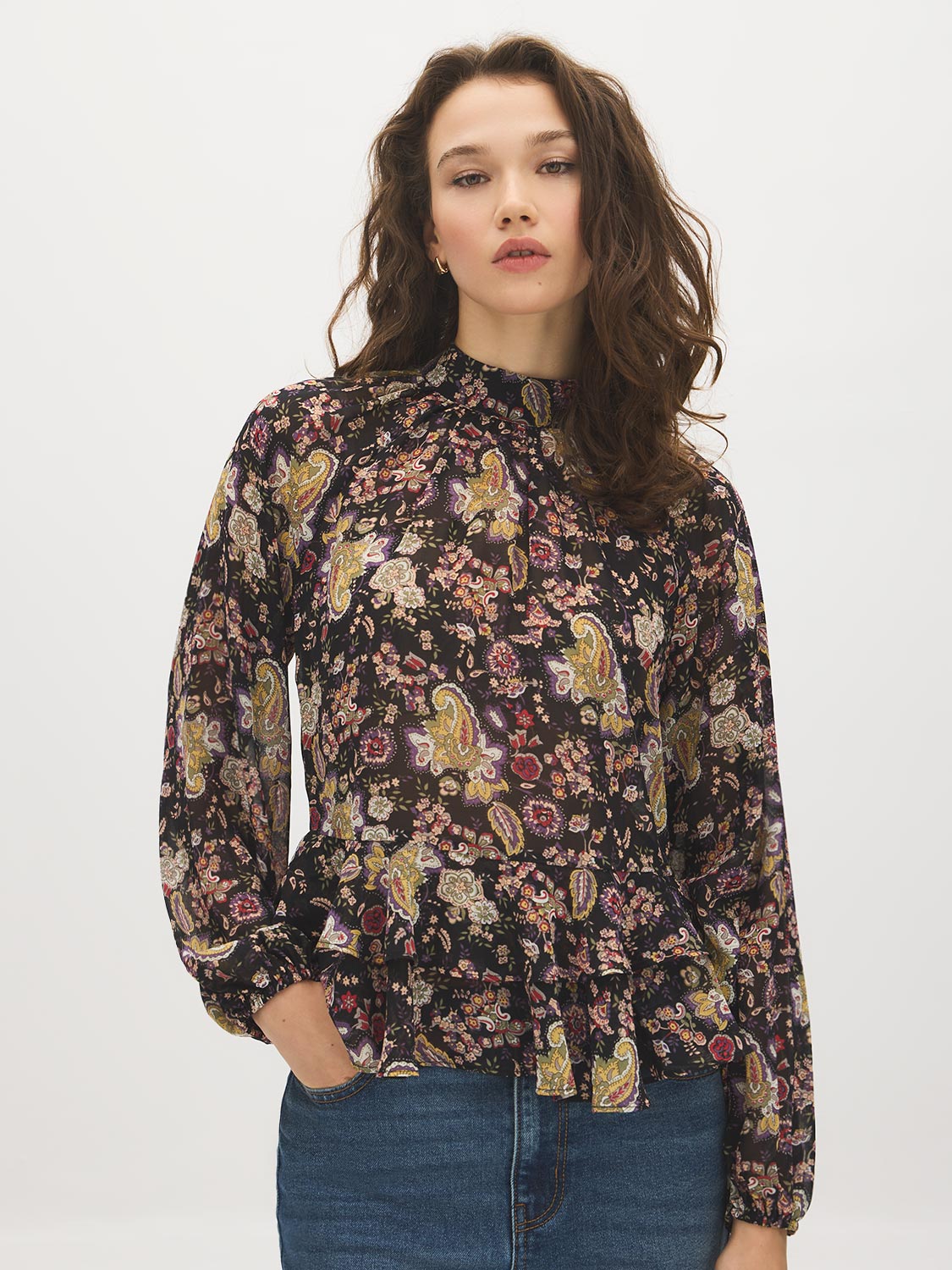 Black Paisley Mock Neck Top with Ruffle Hem - Woman Wearing Long Sleeve Patterned Blouse - Suzy Shier