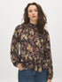 Black Paisley Mock Neck Top with Ruffle Hem - Woman Wearing Long Sleeve Patterned Blouse - Suzy Shier