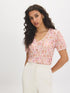 Peach Dust Floral Crinkle V-Neck Top - Woman Wearing Bubble Sleeve Blouse - Suzy Shier