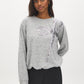 Grey Melange Crew Neck Hacci Top with Sequin Bow - Woman Wearing Knit Top with Bow Detail - Suzy Shier