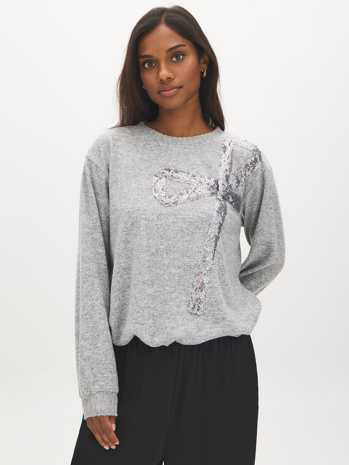 Grey Melange Crew Neck Hacci Top with Sequin Bow - Woman Wearing Knit Top with Bow Detail - Suzy Shier