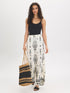 White Wide-Leg Viscose Pants with Black Border Print - Woman Wearing Casual Pull-On Pants - Suzy Shier