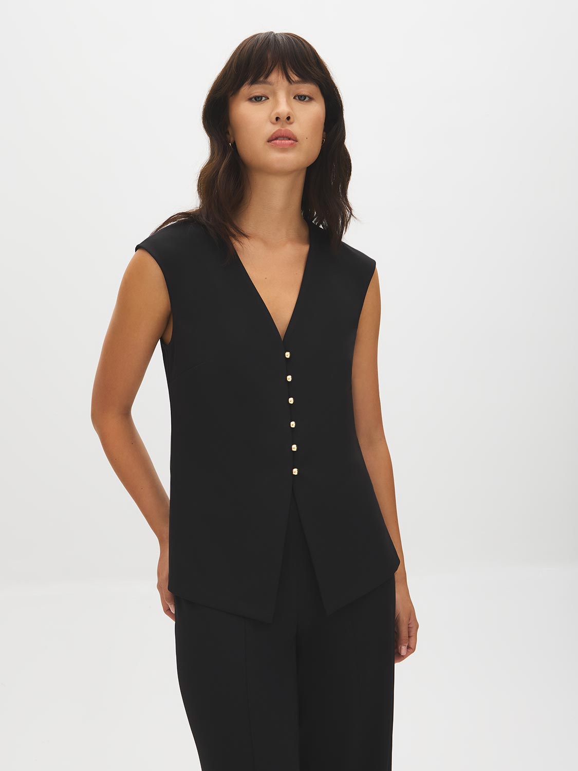 Black V-Neck Button-Front Knit Vest - Woman Wearing Sleeveless Layering Piece - Suzy Shier