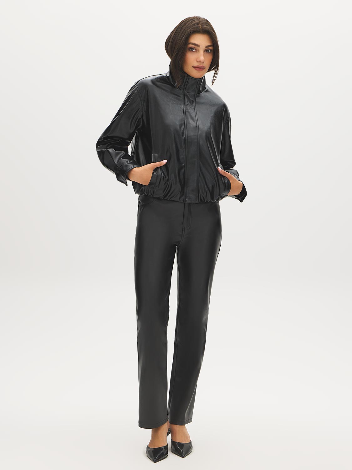 Black Faux Leather Straight Leg Pants - Woman Wearing Five-Pocket Faux Leather Trousers - Suzy Shier