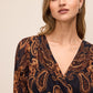 Dijon/Black Paisley Crossover Midi Dress - Close-up Neckline Detail - Le Chateau