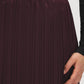 Winetasting Pleated Satin-Like Skirt with Lace Hem - Close-up Fabric Detail - Suzy Shier