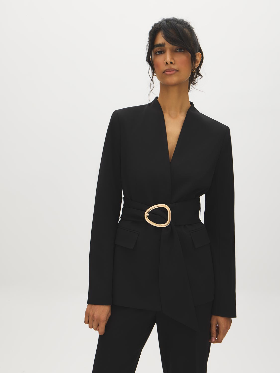 Black Collarless Knit Blazer with Sash Belt - Woman Wearing Tailored Blazer with Gold Buckle - Suzy Shier