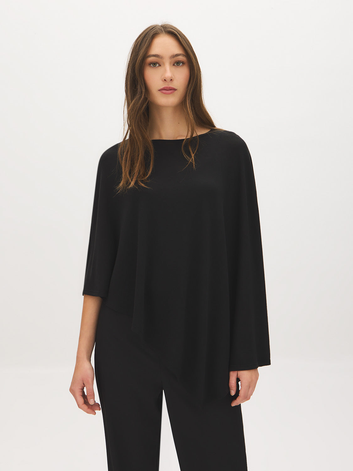 Jet Black Asymmetrical Knit Poncho Top - Woman Wearing Sweater-Cape Hybrid - Suzy Shier